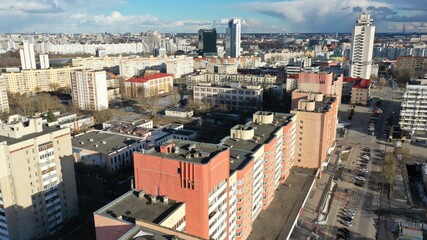 Fototapeta premium Cloudy clouds over the center of Minsk, the capital of Belarus. Panoramic view of the center of Minsk from a height from a drone. Nemiga district, central streets in Minsk.