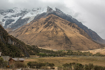 Fototapeta premium View of the mountain and the glacier Salcantay, with incredible clouds, from the city of Soray, in Peru. 