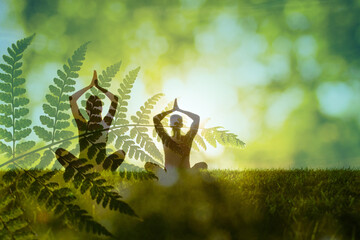 Mind calming inner peace outdoor meditation. Mindful man woman couple meditating surrounded by lush, green vegetation, practicing calmness and inner peace
