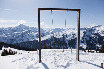 Big swing on Elsenalp Bregenzerwald Panorama in winter time