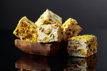 Traditional Turkish delight in a wooden dish.