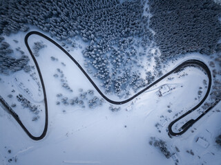 Aerial winter shot top down of road in shape of M
