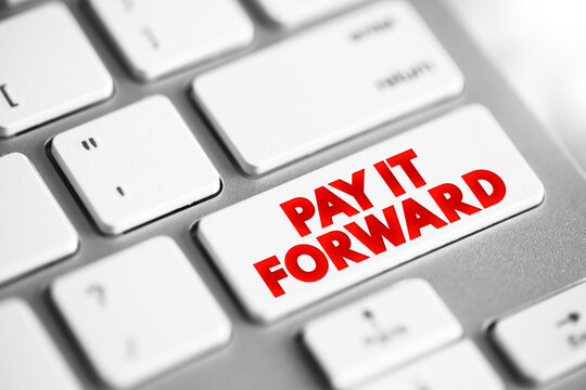 PAY IT FORWARD text button on keyboard, concept background