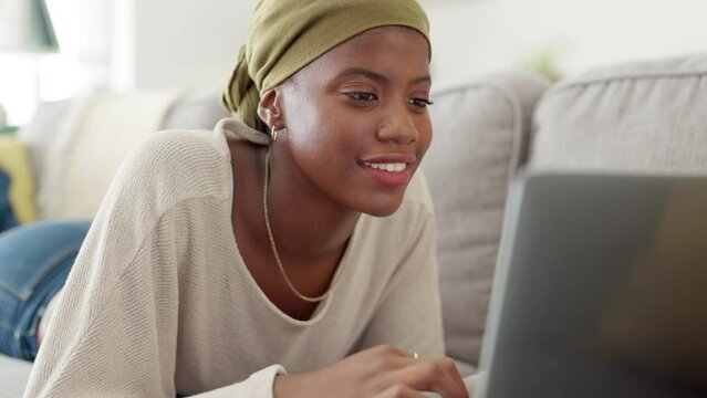 Laptop, typing and black woman on sofa in home, social media or website scrolling. Relax, technology and smile of happy female with computer for networking, internet or web browsing in house lounge.