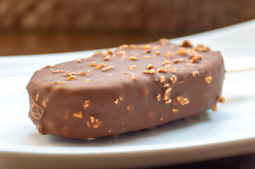 Ice cream with milk chocolate and nuts