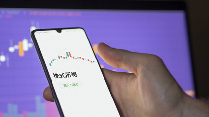 An investor analysing an ETF on a screen. Funds stocks exchange with Japanese text: stock income, buy