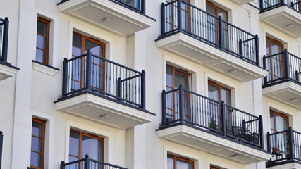 Fototapeta premium Modern architecture building facade with balconies. New apartments. Contemporary apartment building.