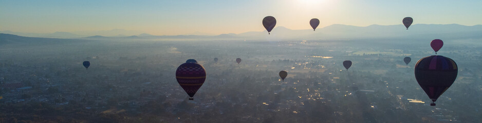 Sunrise on hot air balloon over the Teotihuacan pyramid