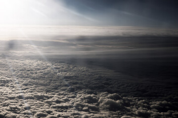 Heaven with sun light rays or beams bursting from clouds in blue sky. Spiritual religious background. Realistic tranquil cloudscape view, beautiful skyey paradise backdrop