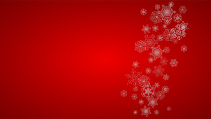 Fototapeta na wymiar Christmas background with silver snowflakes and sparkles. Horizontal New Year and Christmas background for party invitation, banner, gift cards, retail offers. Falling snow. Frosty winter backdrop.