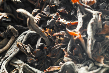 Black loose leaf tea. Dry black tea leaves close up
