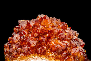 citrine (heated amethyst) druse on black background. macro detail texture background. close-up raw...