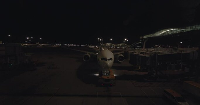 Plane Through The Terminal Window At Hong Kong Airport At Night