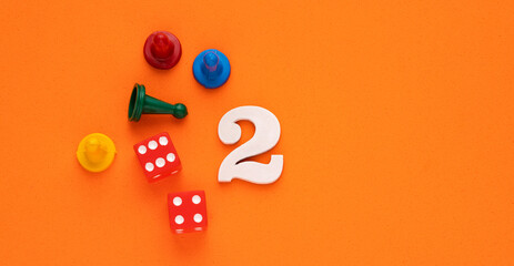 Number 2 with dice and board game pieces - Orange eva rubber background