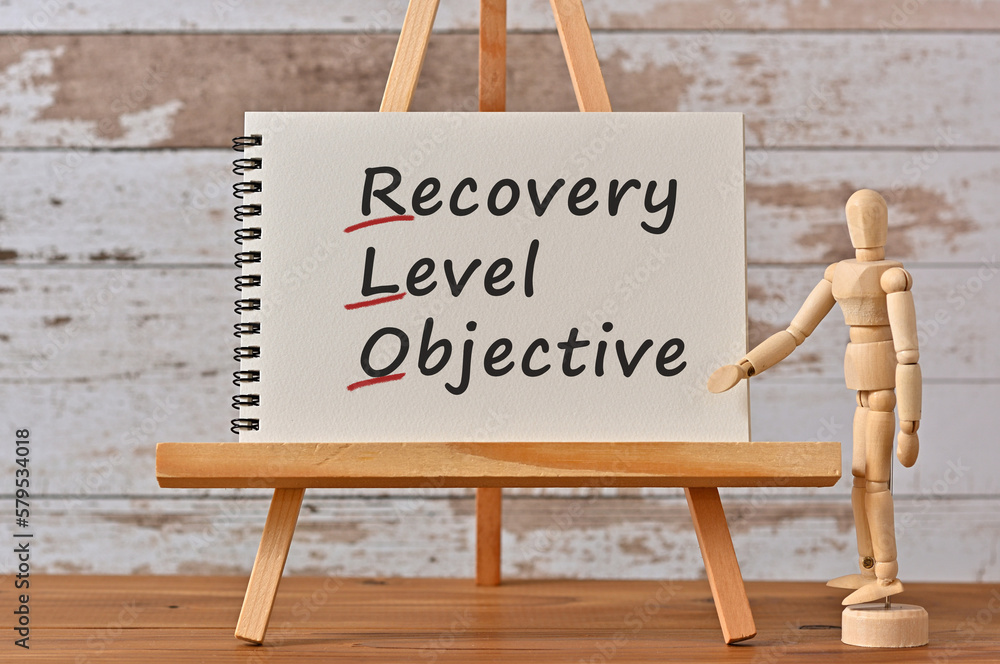 Poster there is notebook with the word recovery level objective. it is an eye-catching image.