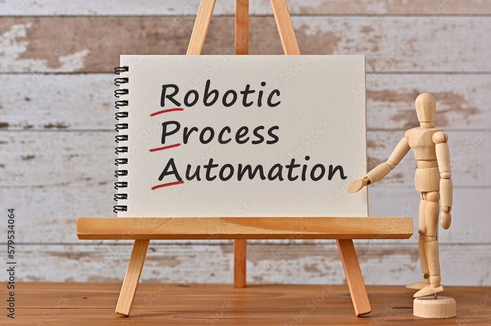 Poster there is notebook with the word robotic process automation. it is an eye-catching image.