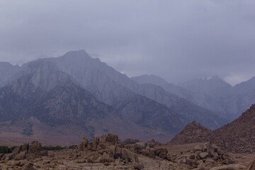 storm clouds roll through the eastern Sierra Nevada mountains and the Alabama hills, near lone pine, California