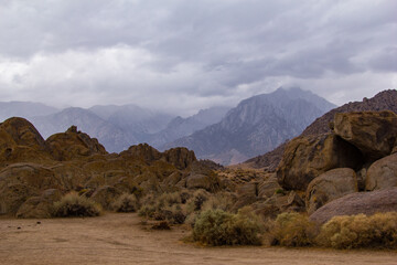 storm clouds roll through the eastern Sierra Nevada mountains and the Alabama hills, near lone pine, California