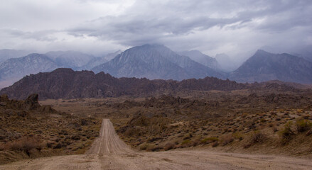storm clouds roll through the eastern Sierra Nevada mountains and the Alabama hills, near lone pine, California