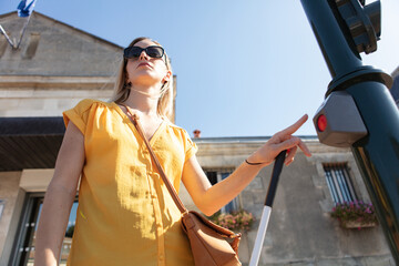 attractive blond woman ready to cross the road