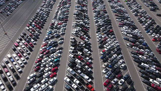 Aerial view of a parking lot full of used cars.