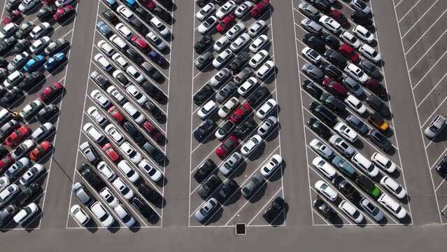 Aerial view of a parking lot full of used cars.