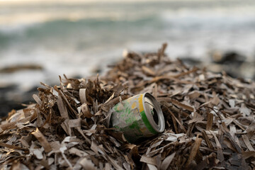 Used Aluminum can waste on ocean sea coast,environmental debris pollution