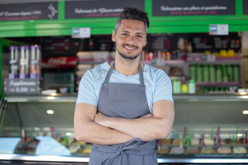 Fototapeta premium portrait of waiter in an ice-cream parlour