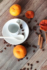 cup of coffee with cinnamon and orange