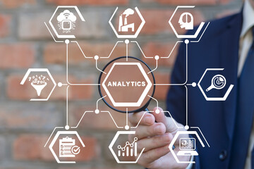 Businessman using virtual touchscreen presses word: ANALYTICS. Concept of analytics industry 4.0 business finance big data AI IoT tech. Analysis information technology.