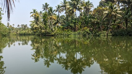 Fototapeta na wymiar A passenger boat stopped in a river in Kerala