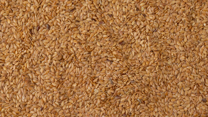 Golden linseed top view background.