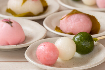 Japanese sweets in spring. Three-color dumplings, sakura mochi, buns....