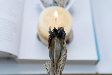 Ritual with white sage smoke and white candle