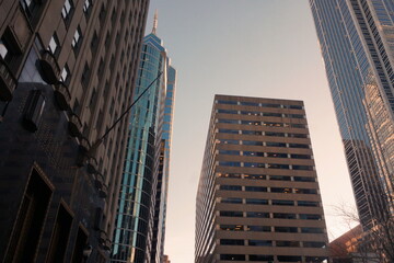 Fototapeta na wymiar City Skyline with Glass and Brick Towers and Sky