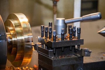 The lathe machine finish cut the brass parts by lathe tools.