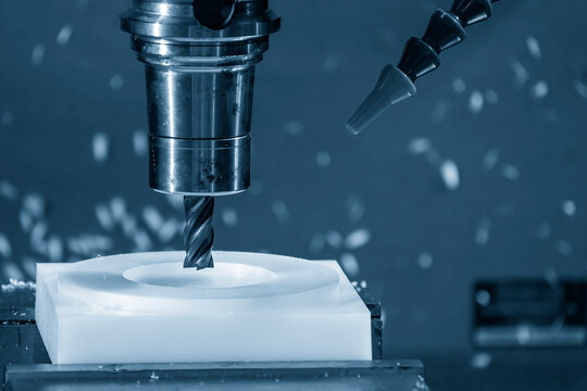 The  CNC milling machine cutting the nylon 6 material part with flat end mill tool.