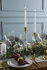Stylish elegant table setting for festive dinner indoors