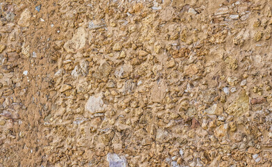 Very rough ancient stone wall