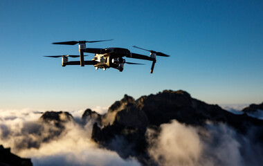 A drone flying over nature and making beautiful pictures and videos.