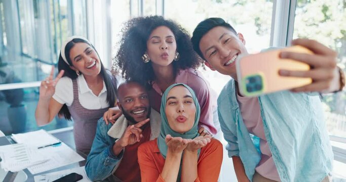 Phone, team building or happy employees take a selfie in an office room at work for social media on a break. Smile, friends or fun colleagues with pride, diversity or motivation taking group pictures