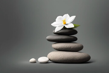 Zen pebble stones and white flower on gray background. Generative AI