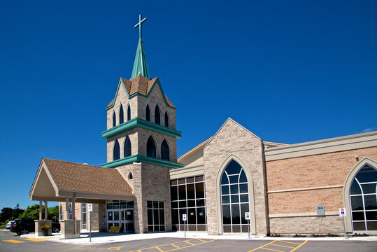 The exterior of a church with a clear blue sky