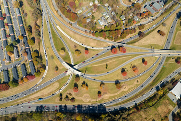 American freeway intersection in Asheville, North Carolina with fast driving cars and trucks in autumnal season. View from above of USA transportation infrastructure