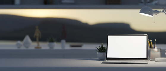 Workspace with laptop mockup, table lamp, and copy space over blurred modern room in background