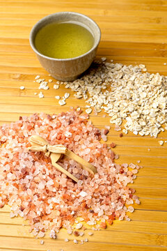 Overhead View Of Coarse Salt, Oats, And Oil.