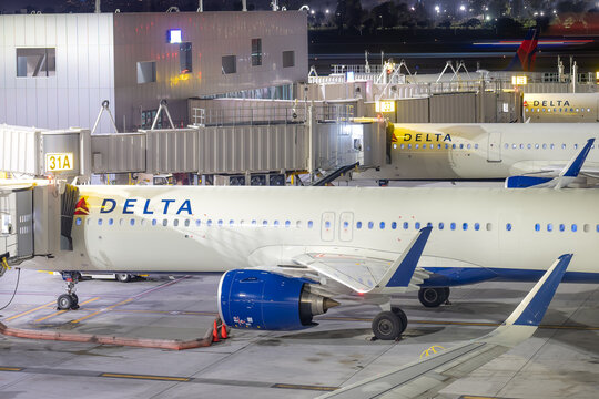 Los Angeles, CA, USA - February 7, 2023:  Evening image of Delta Air Lines airplanes at gates at Los Angeles International Airport, LAX
