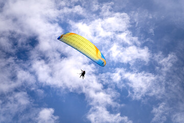 Parachute jumpers perform during the Paragliding festival. The annual paragliding festival is held in Mu Cang Chai, Vietnam