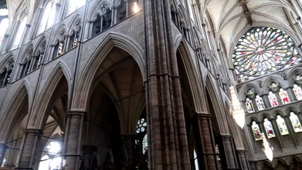 Inside of Westminster Abbey with a big stained glass rosette on top. Gothic cathedral decoration - Powered by Adobe