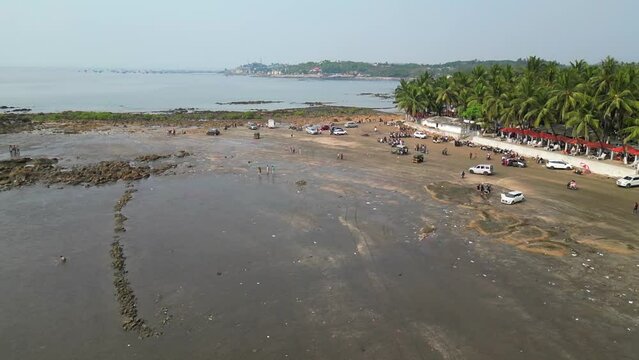 people enjoying at  gorai beach drone shot